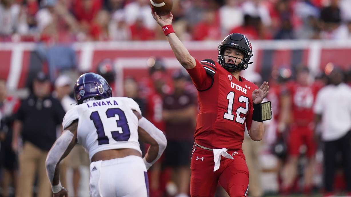 Utah quarterback Charlie Brewer (12) throws a pass as Weber State linebacker Sherwin Lavaka (13) defends during the first half of an NCAA college football game Thursday, Sept. 2, 2021, in Salt Lake City.