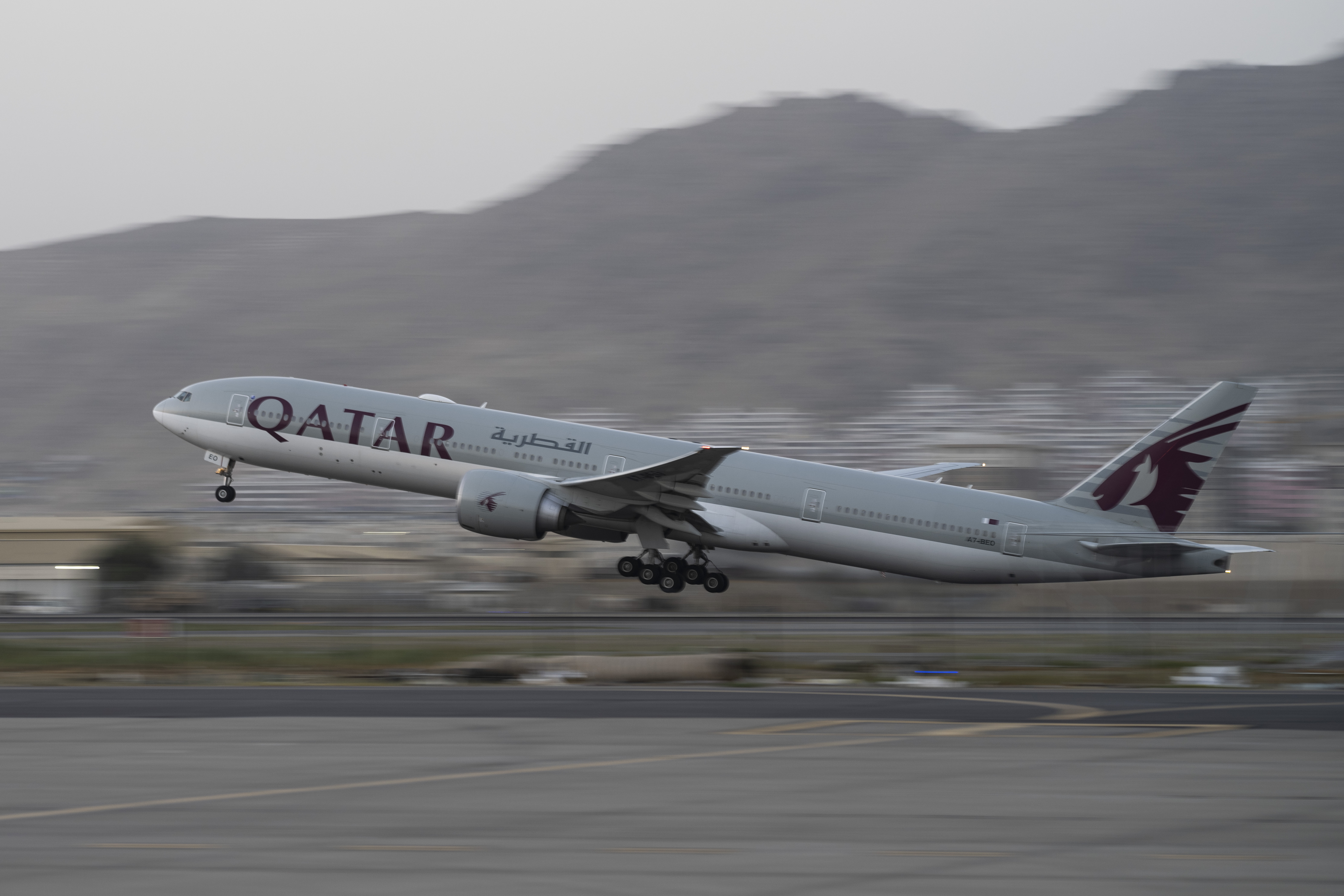 A Qatar Airways aircraft takes off with foreigners from the airport in Kabul, Afghanistan, Thursday.  Thousands of at-risk Afghans who had helped the United States are still stranded in their homeland.  