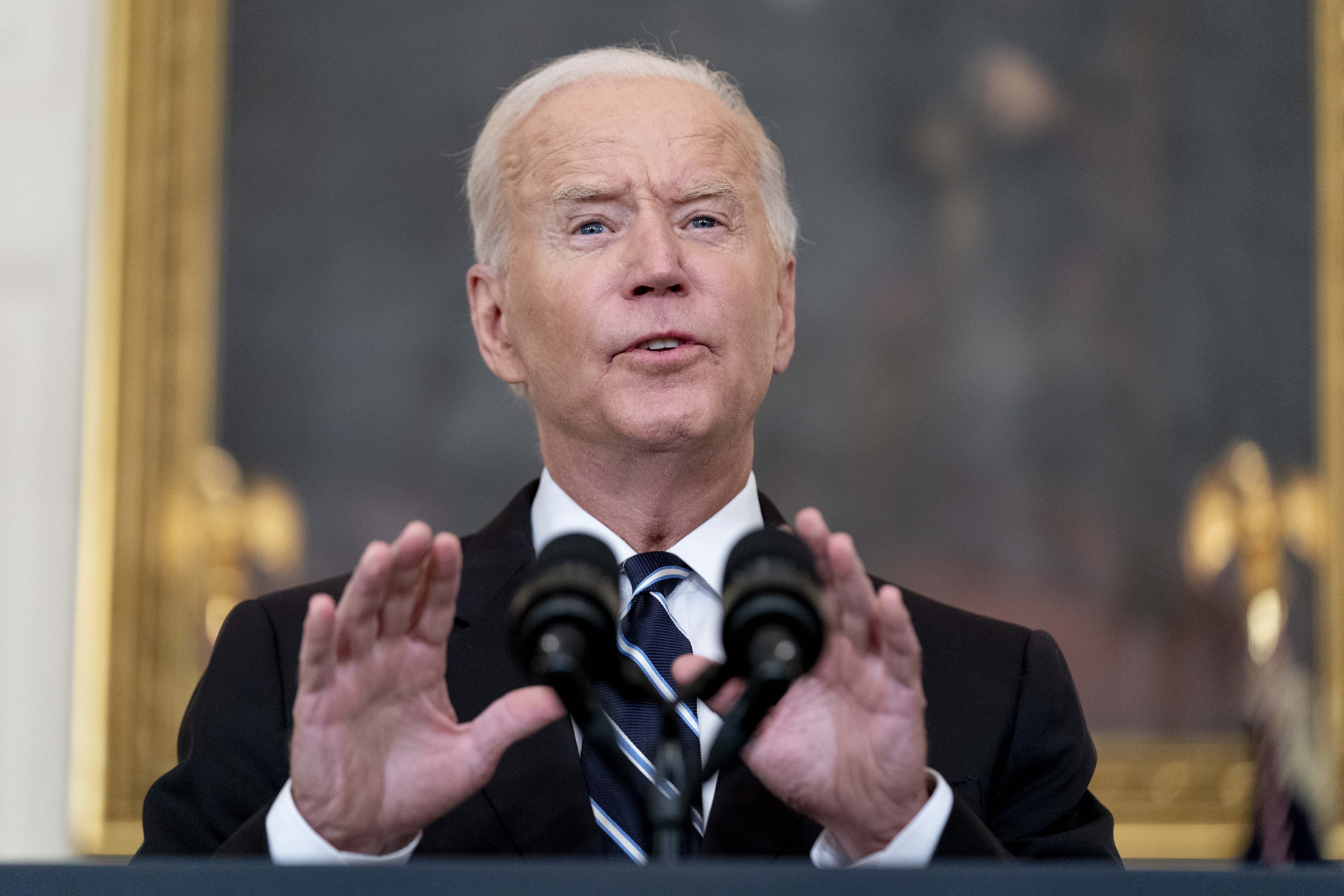 President Joe Biden speaks in the State Dining Room at the White House, Thursday in Washington. Biden is announcing sweeping new federal vaccine requirements affecting as many as 100 million Americans in an all-out effort to increase COVID-19 vaccinations and curb the surging delta variant.