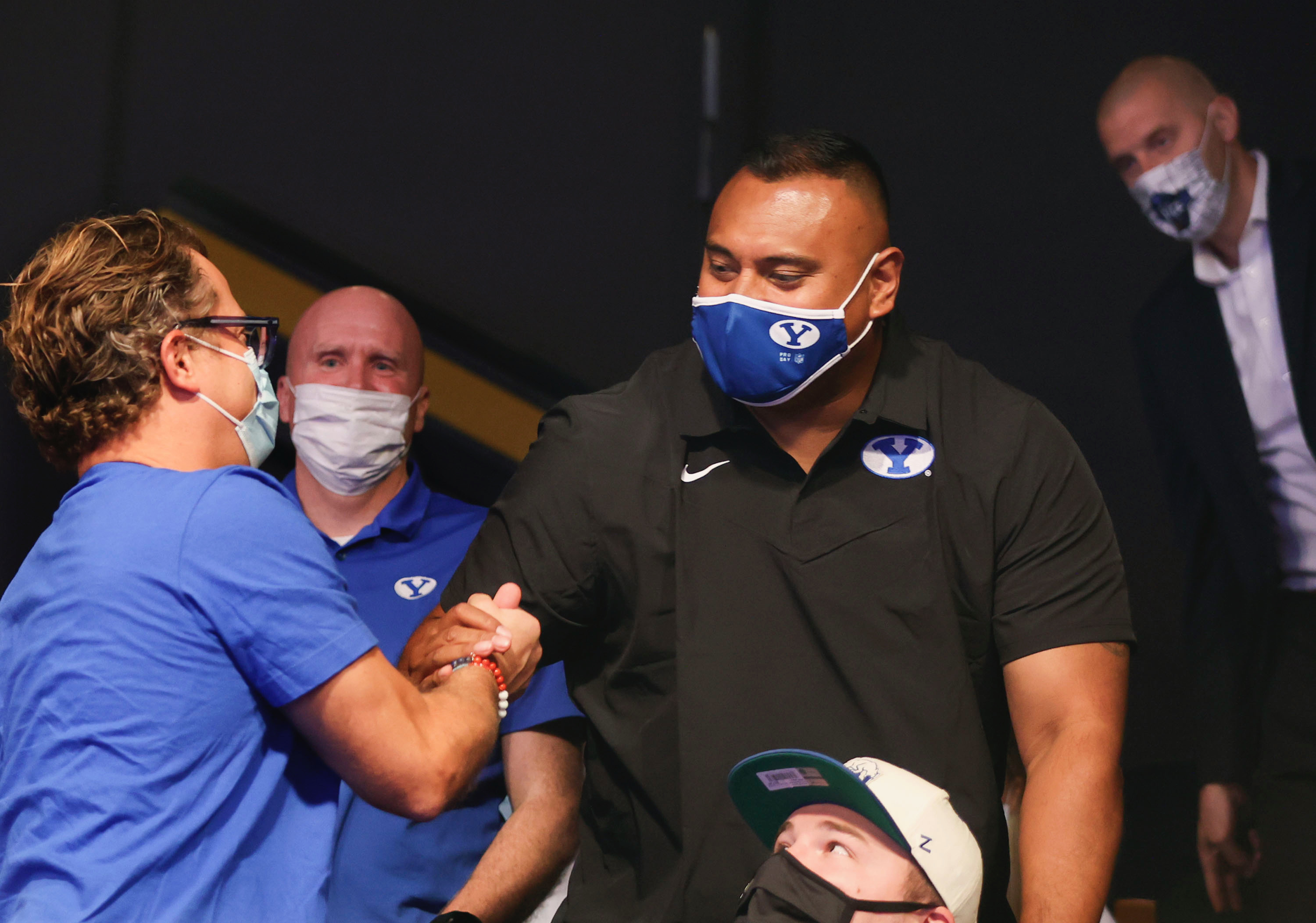 Josh James and BYU football coach Kalani Sitake celebrate at a press conference announcing that BYU has accepted an invitation to the Big 12 Conference at BYU in Provo on Friday, Sept. 10, 2021. BYU will play all sports provided by the Big 12 except for equestrian, rowing and wrestling. Men’s volleyball will continue to play in the Mountain Pacific Sports Federation, as the Big 12 does not offer the sport.