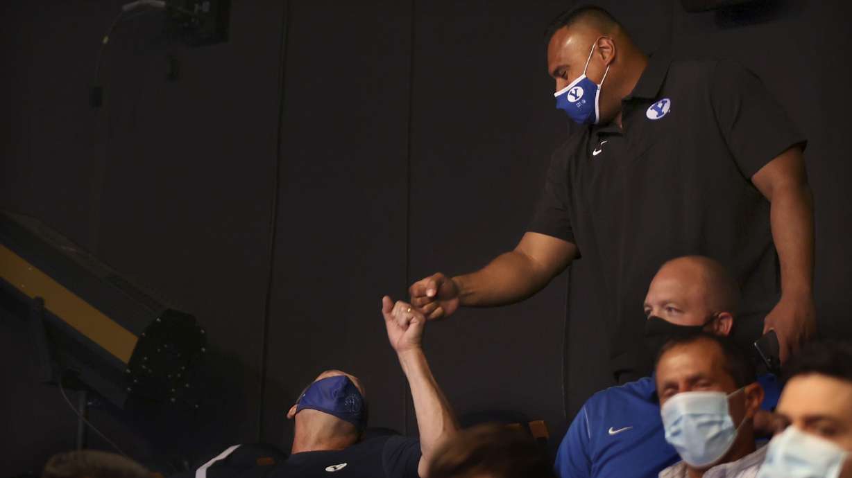 BYU football coach Kalani Sitake is congratulated at a press conference announcing that BYU has accepted an invitation to the Big 12 Conference at BYU in Provo on Friday, Sept. 10, 2021.