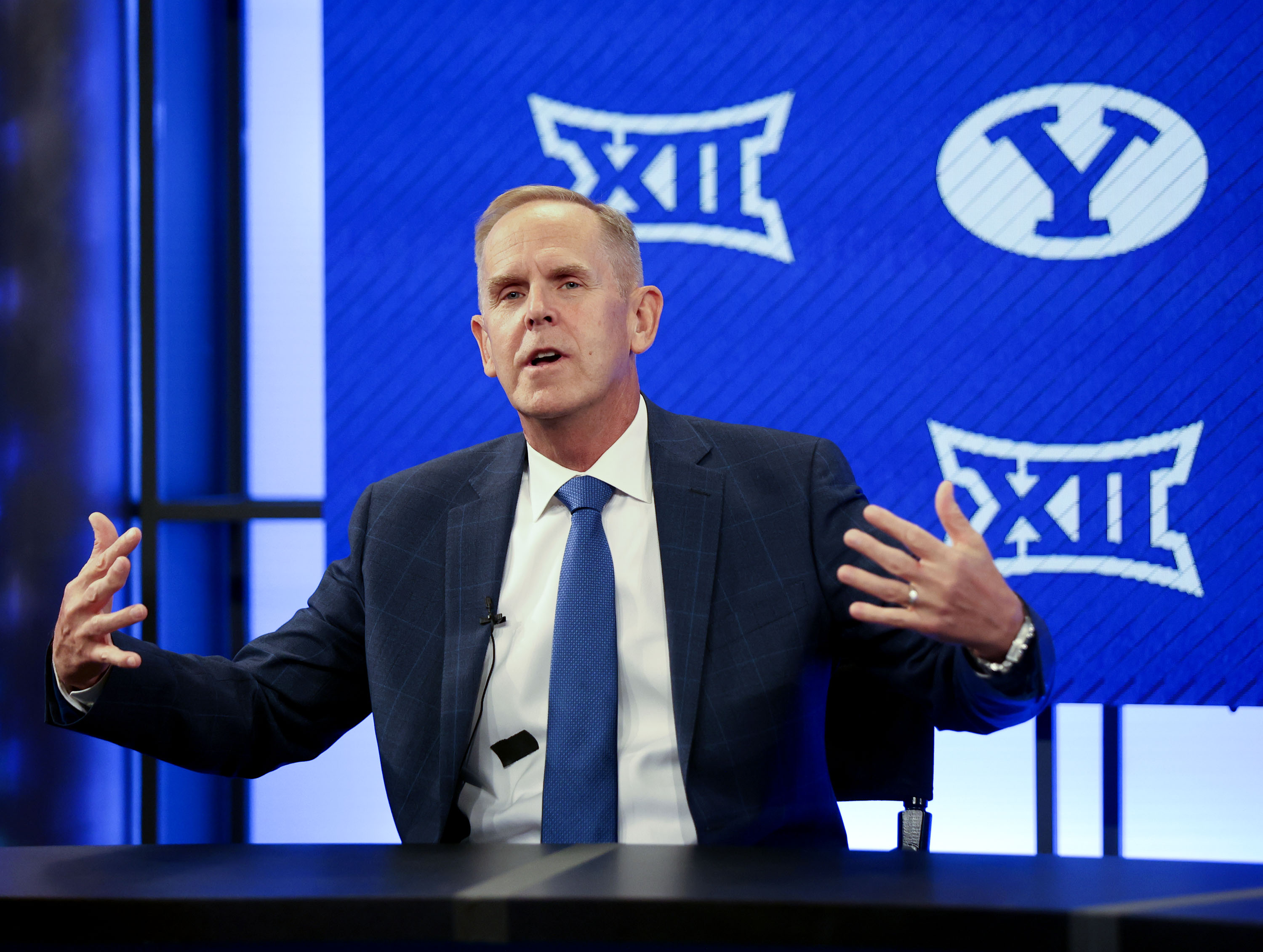 BYU athletic director Tom Holmoe gestures while stating, "I love the fact that we get to go into the Big 12 with all our teams" during a press conference announcing that BYU has accepted an invitation to the Big 12 Conference at BYU in Provo on Friday, Sept. 10, 2021. BYU will play all sports provided by the Big 12 except for equestrian, rowing and wrestling. Men’s volleyball will continue to play in the Mountain Pacific Sports Federation, as the Big 12 does not offer the sport.