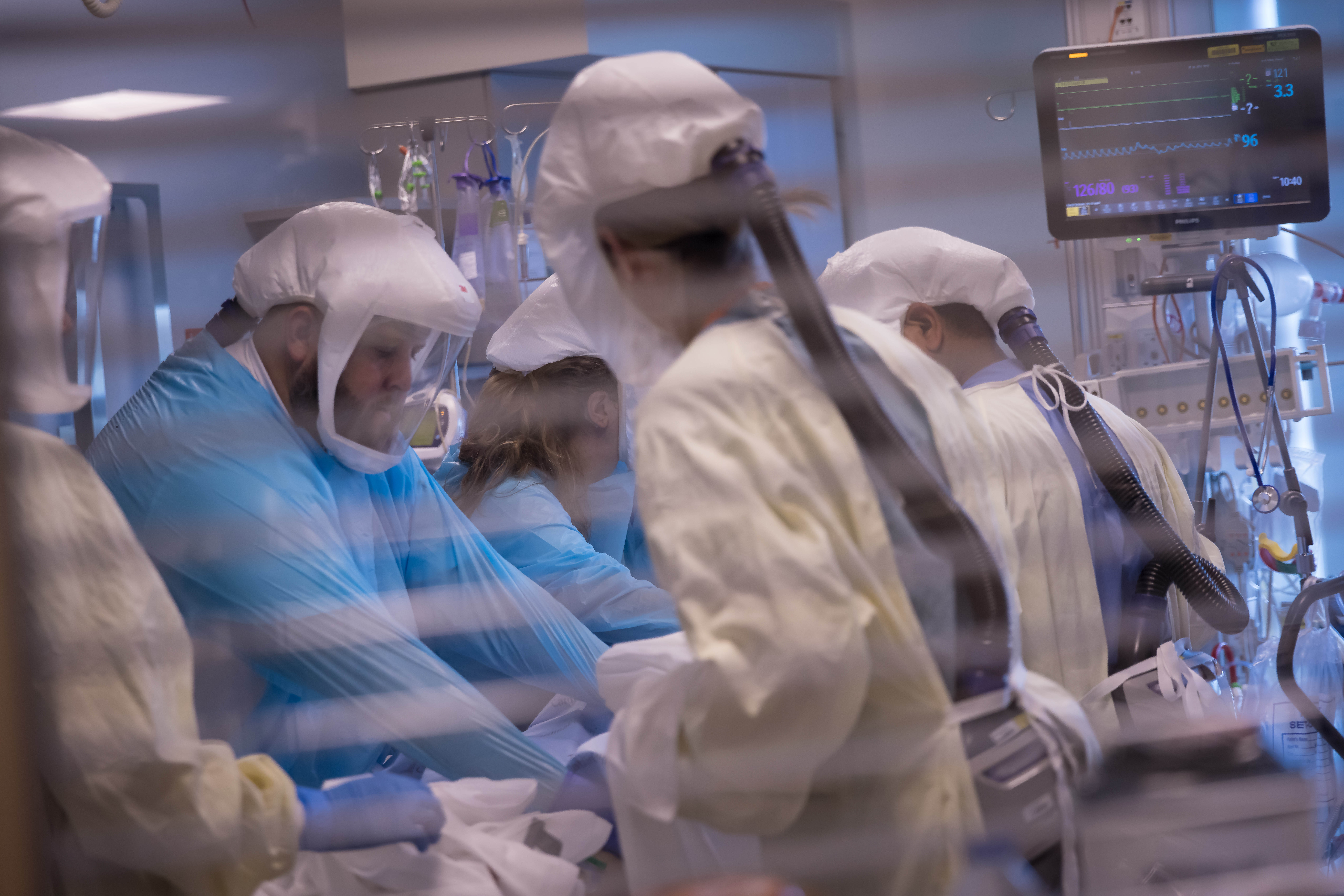 University of Utah Health workers treat patients inside the medical intensive care unit at University of Utah Hospital on July 30, 2021.