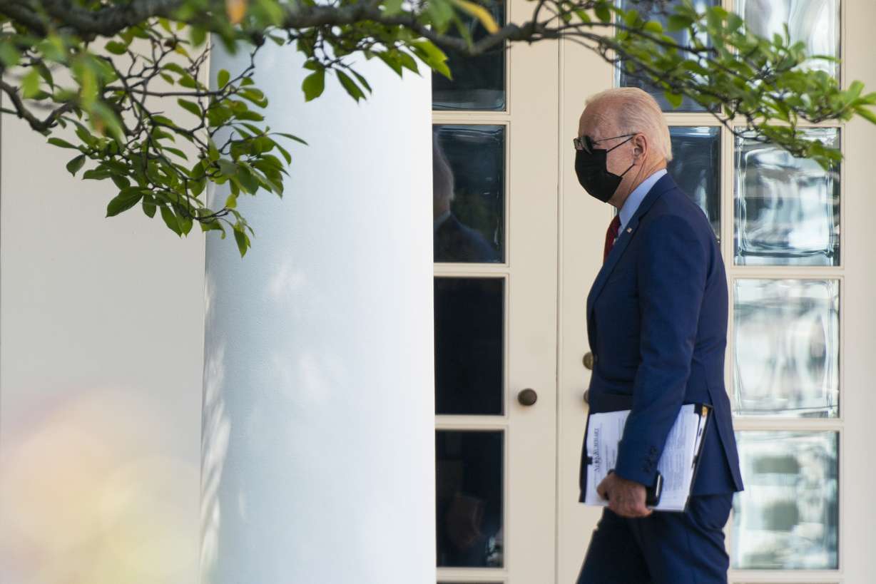 President Joe Biden walks along the Colonnade towards the Oval Office as he returns to the White House after visiting Brookland Middle School in northeast Washington, Friday, Sept. 10, 2021. Biden has encouraged every school district to promote vaccines, including with on-site clinics, to protect students as they return to school amid a resurgence of the coronavirus.