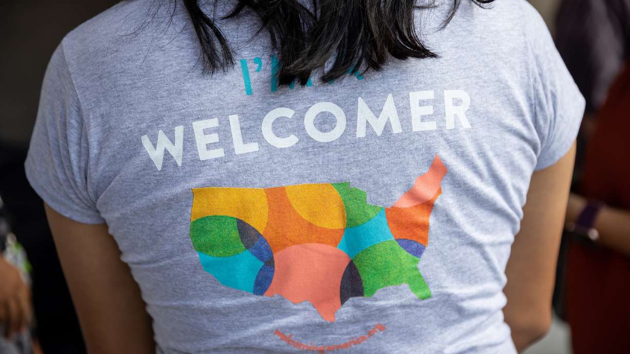 Efrén Corado García, diversity and inclusion officer for the Salt Lake County Mayor’s Office, talks with others who are helping to welcome refugees to the community at an event in Taylorsville on Friday. The event kicked off the upcoming Welcoming Week Salt Lake, which highlights the county’s success at bringing immigrants and refugees in to the community.