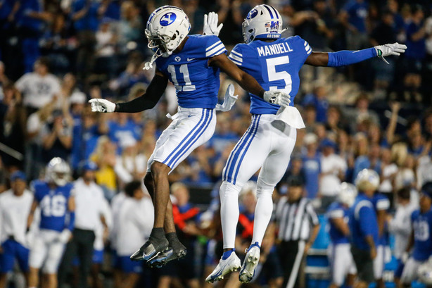 BYU cornerbacks D'Angelo Mandell (5) and Isaiah Herron celebrate an interception during the first half of an NCAA college football game at LaVell Edwards Stadium in Provo on Saturday, Sept. 11, 2021.