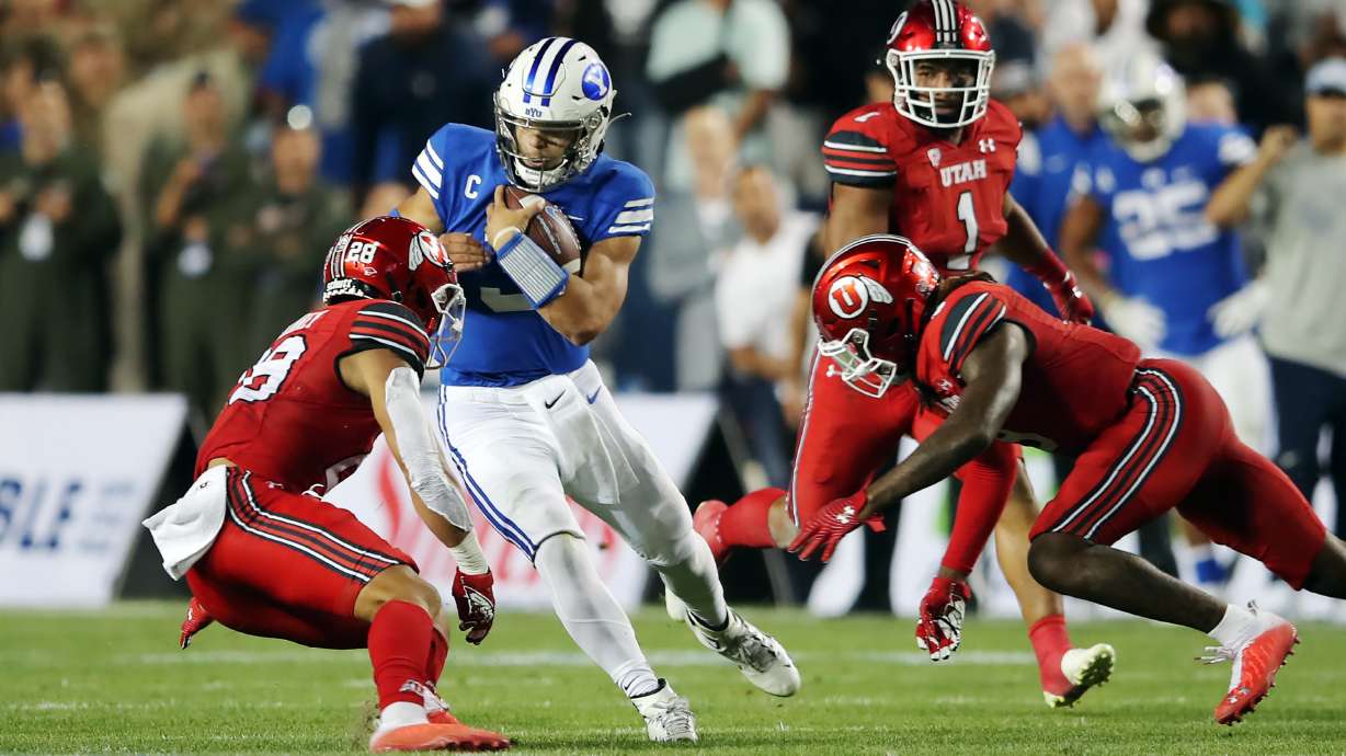 Brigham Young Cougars quarterback Jaren Hall (3) slides down after a run as BYU and Utah play an NCAA football game at LaVell Edwards Stadium in Provo on Saturday, Sept. 11, 2021.