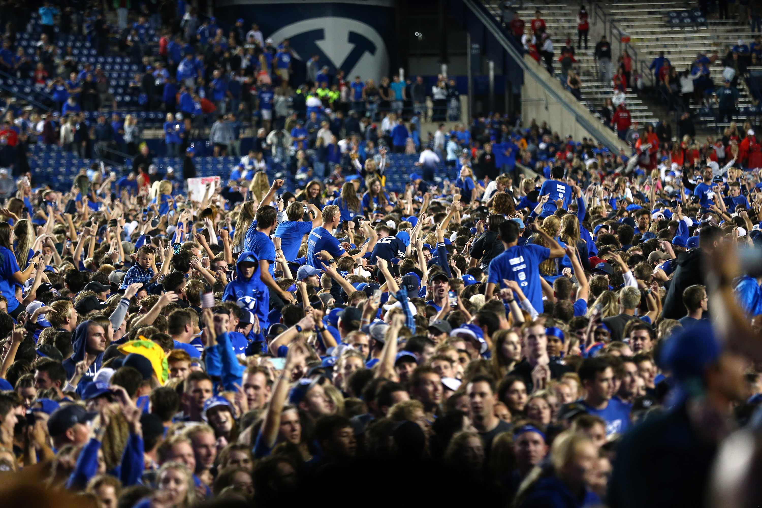 Fans swarm the field after BYU defeated Utah in an NCAA football game at LaVell Edwards Stadium in Provo on Saturday, Sept. 11, 2021. BYU won 27-16 ending a 9 game losing streak to the Utes.