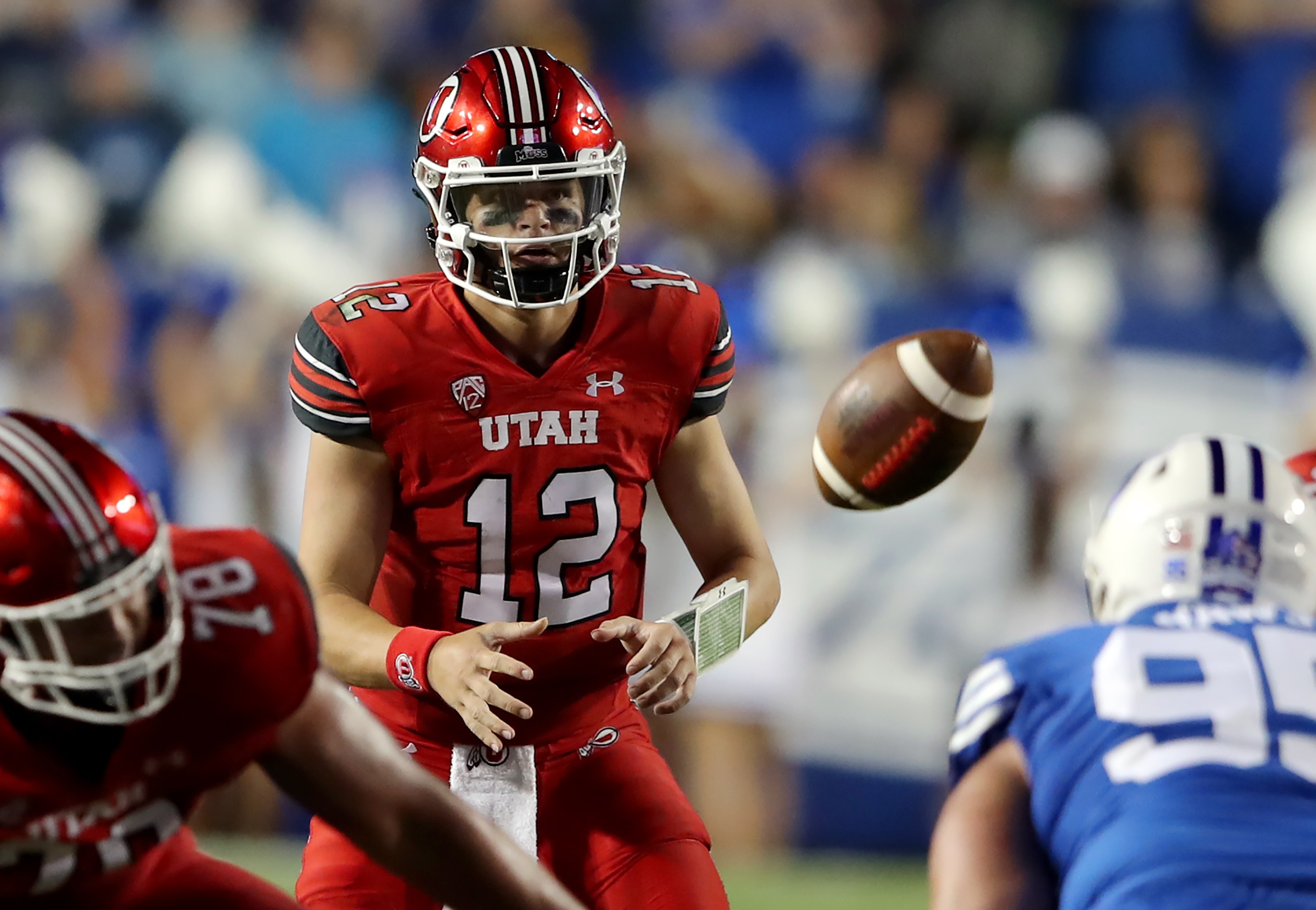 Utah Utes quarterback Charlie Brewer (12) takes a snap as BYU and Utah play an NCAA football game at LaVell Edwards Stadium in Provo on Saturday, Sept. 11, 2021. BYU won 27-16 ending a 9 game losing streak to the Utes.