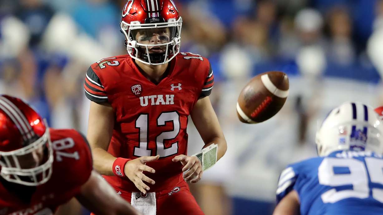 Utah Utes quarterback Charlie Brewer (12) takes a snap as BYU and Utah play an NCAA football game at LaVell Edwards Stadium in Provo on Saturday, Sept. 11, 2021. BYU won 27-16 ending a 9 game losing streak to the Utes.