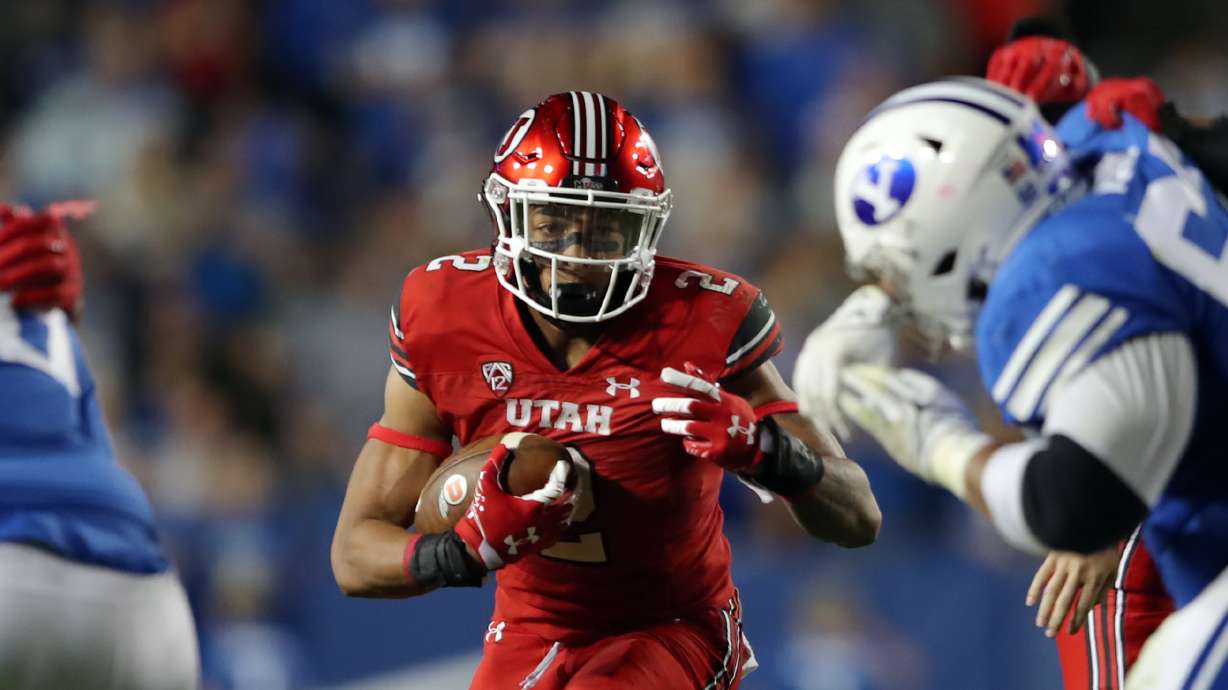 Utah Utes running back Micah Bernard (2) finds an opening in the line as BYU and Utah play an NCAA football game at LaVell Edwards Stadium in Provo on Saturday, Sept. 11, 2021. BYU won 27-16 ending a 9 game losing streak to the Utes.