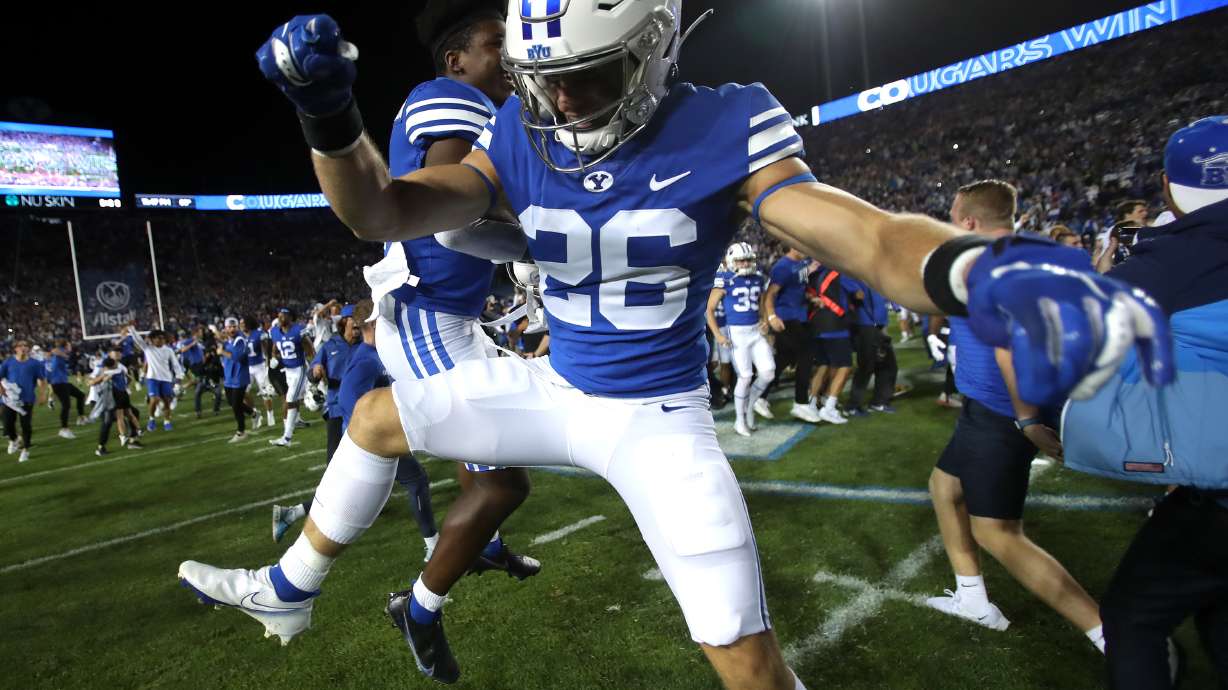 BYU players celebrate as they defeat Utah in an NCAA football game at LaVell Edwards Stadium in Provo on Saturday, Sept. 11, 2021. BYU won 27-16 ending a 9 game losing streak to the Utes.
