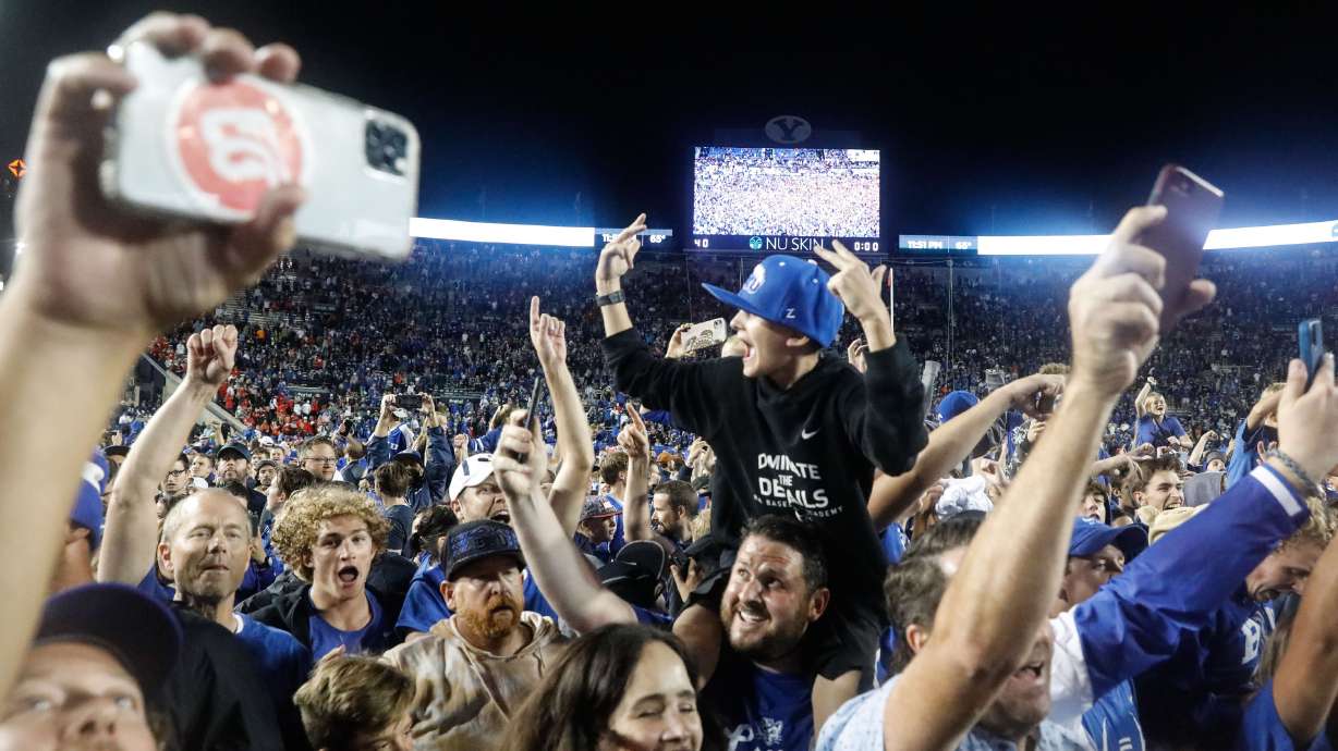 BYU fans celebrate after winning an NCAA college football game against Utah at LaVell Edwards Stadium in Provo on Saturday, Sept. 11, 2021. BYU won 26-17.
