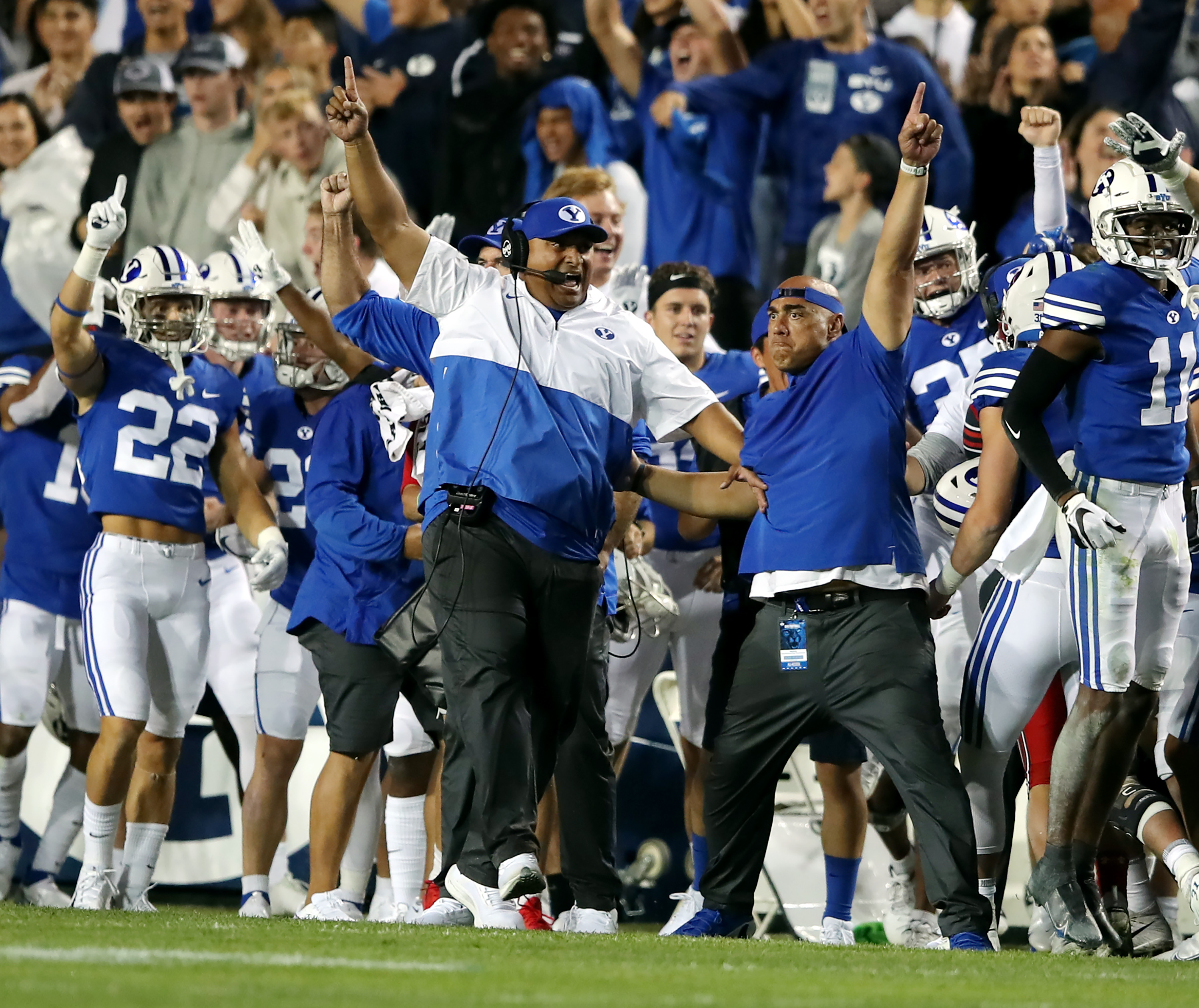 BYU head coach Kalani Sitake and the rest of the BYU sideline begin to celebrate as they defeat Utah in an NCAA football game at LaVell Edwards Stadium in Provo on Saturday. BYU won 26-17, ending a nine-game losing streak to the Utes.