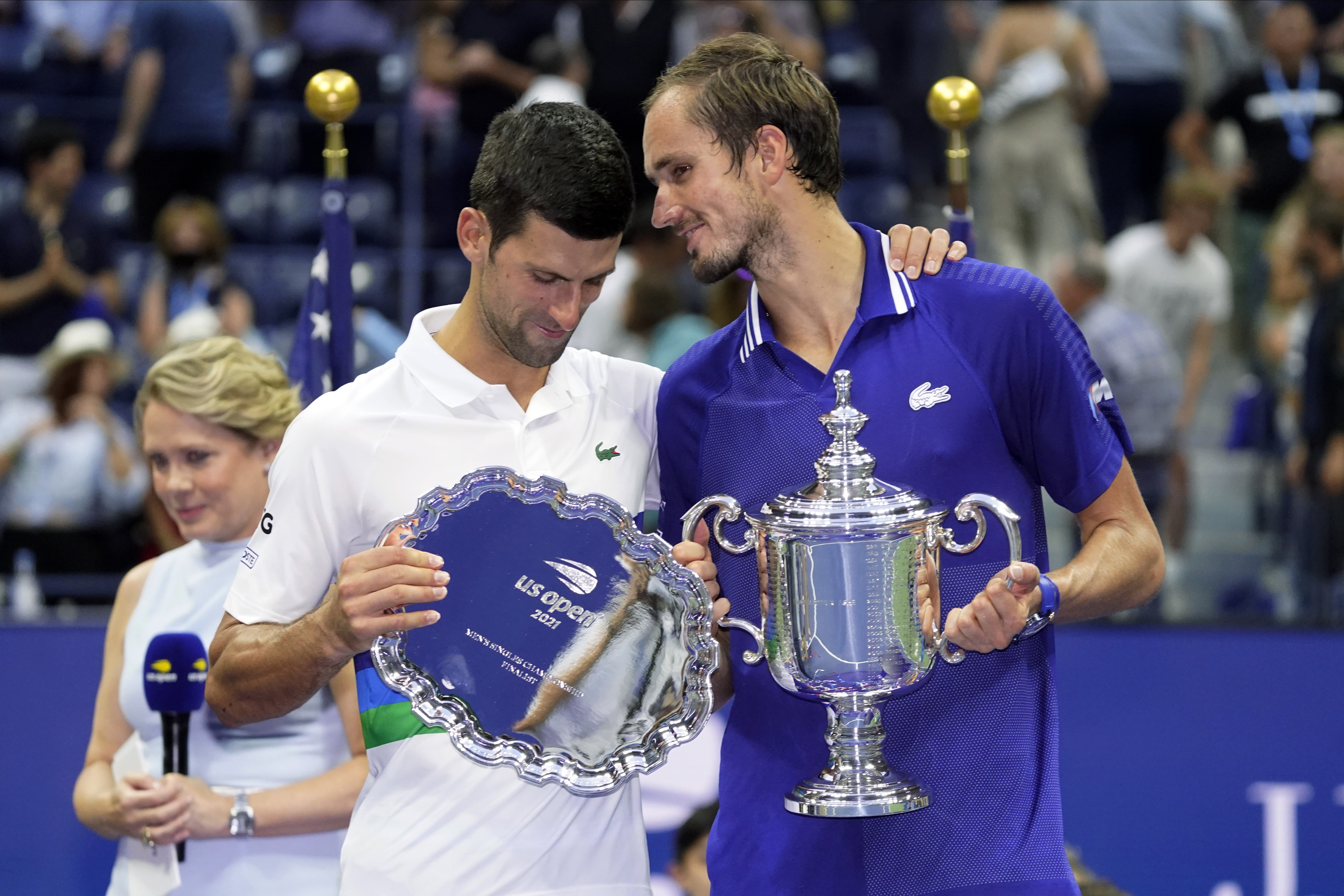Daniil Medvedev, of Russia, right, talks with Novak Djokovic, of Serbia, after defeating Djokovic in the men's singles final of the US Open tennis championships, Sunday, Sept. 12, 2021, in New York.