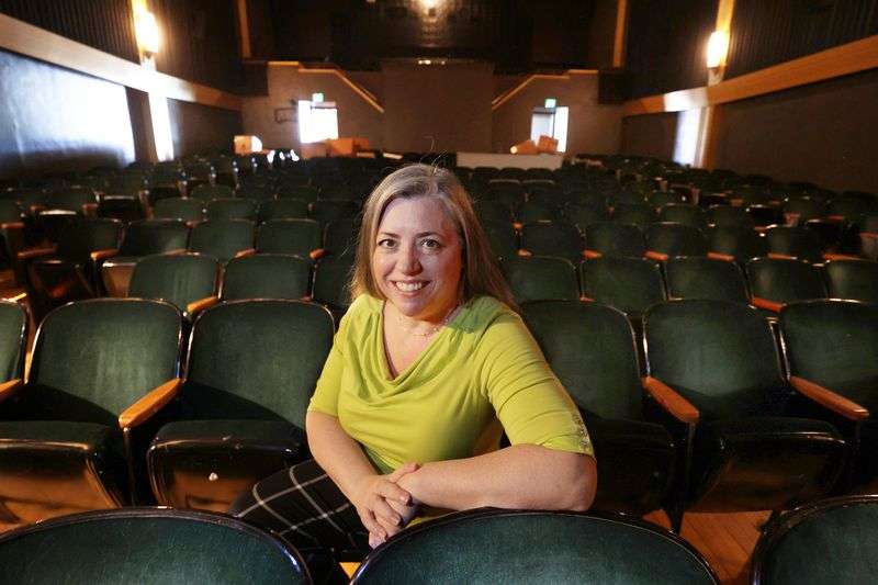 Tori A. Baker, director of the Salt Lake Film Society,
sits in the Tower Theatre in Salt Lake City on Friday, Aug. 27,
2021. The Salt Lake Film Society oversees one of the biggest art
house cinema operations in the country but last spring shut its
doors due to COVID-19. The society has developed and launched its
own custom streaming platform.