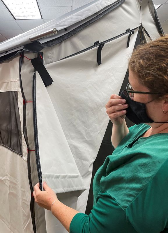 Diamond Brand COO Lauren Rash inspects a prototype of the company's new wall tent, which relies on resin-based zippers and Velcro, at Diamond Brand factory in Fletcher, outside Asheville, North Carolina, Aug. 11.