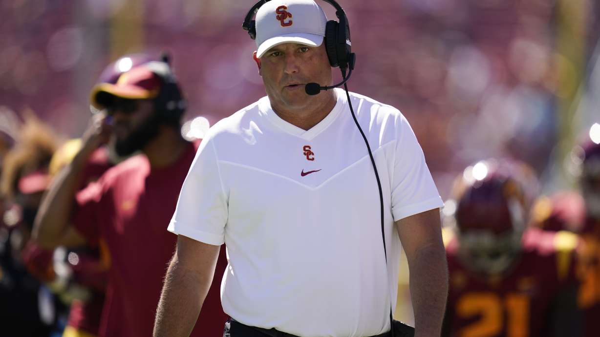 Southern California head coach Clay Helton walks on the sideline during an NCAA college football game against San Jose State Saturday, Sept. 4, 2021, in Los Angeles.