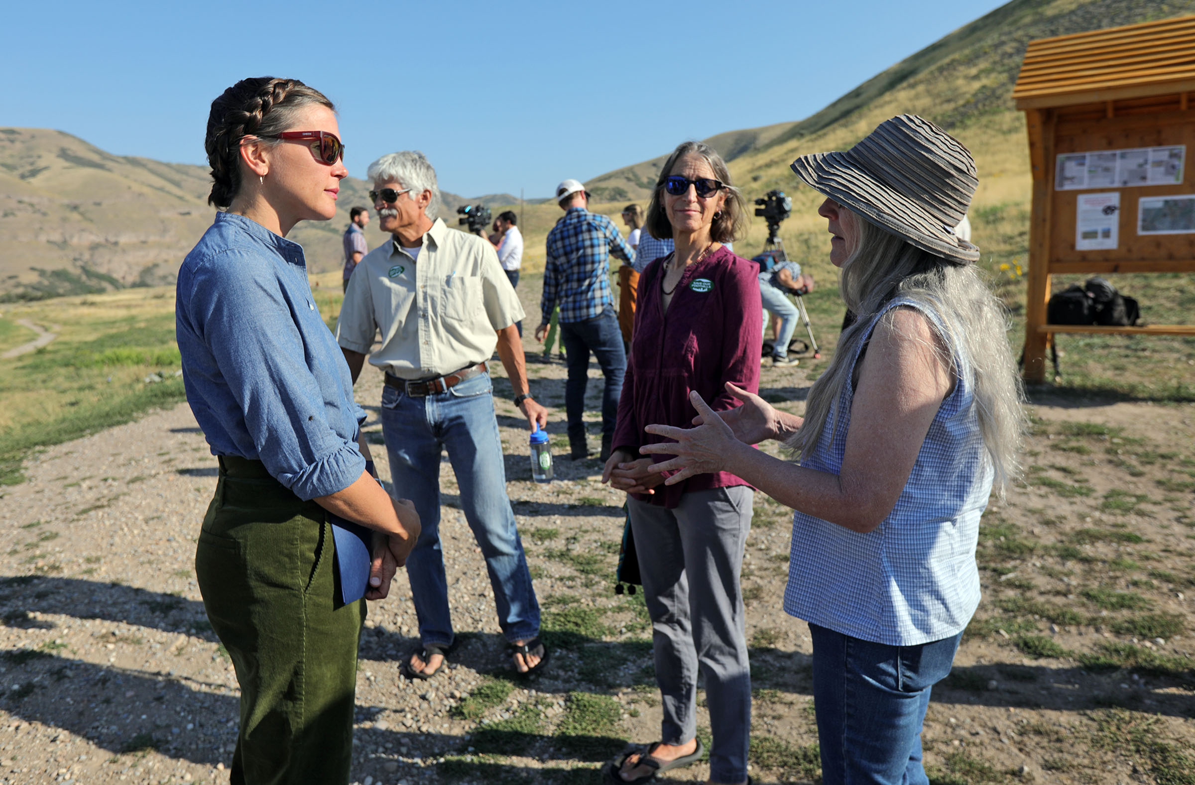 Salt Lake City Mayor Erin Mendenhall, left, talks with Save Our Canyons campaign members Dan Schelling, Hilary Jacobs and Debbie Feder after discussing the city’s plans to review the Foothills Trail System and pause building trails during a press conference at the Bonneville Shoreline Access trailhead in Salt Lake City on Tuesday. The Save Our Canyons campaign members thanked the mayor for paying attention and being inclusive.