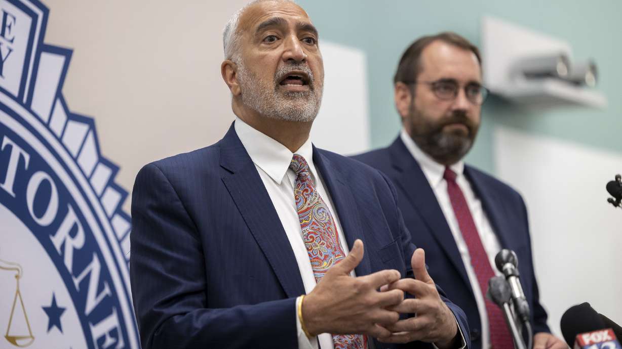Salt Lake County District Attorney Sim Gill, left, discusses the death penalty in Utah at the Salt Lake County District Attorney’s Office building in Salt Lake City on Tuesday, as Utah County Attorney David Leavitt looks on.
