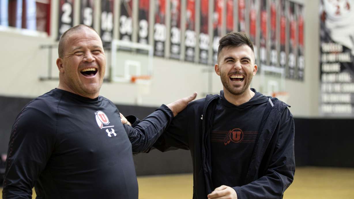 Craig Rydalch and his son, Beau, joke around after shooting baskets at the Jon M. and Karen Huntsman Basketball Facility in Salt Lake City on Wednesday, Feb. 27, 2019.