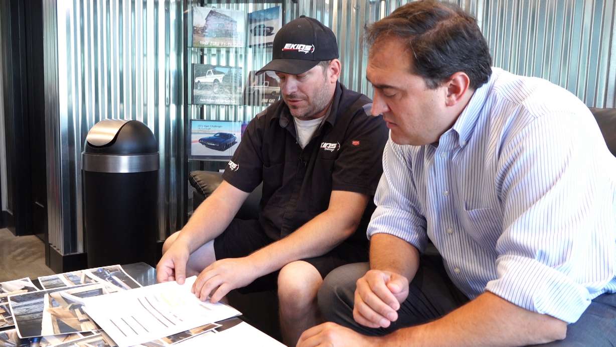 KSL Investigator Matt Gephardt sits with Derek Ekins, owner of Ekins Garage, in West Jordan. Gephardt reached out to the shipping company, Worldwide Express, regarding a damaged shipment after Ekins was left holding the bag.