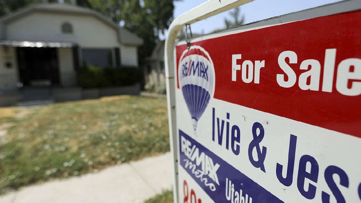 A "for sale" sign is pictured in Salt Lake City on July 15. A new study says three Utah cities and an Idaho city are in the top 10 "most overvalued" housing markets in the entire country.
