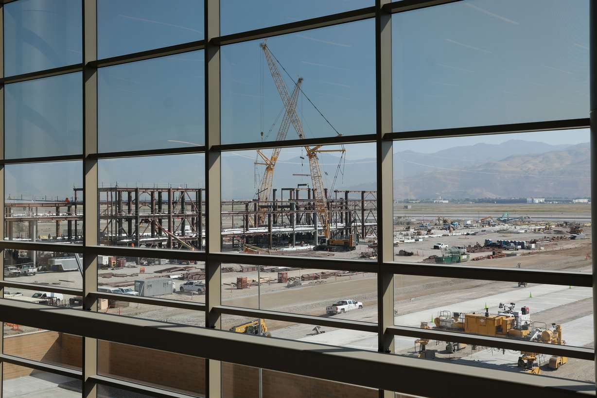 Construction on Phase 2 of the Salt Lake City International Airport is pictured through the windows of the completed portion of the facility on Wednesday, which marked the first anniversary of the opening of Phase 1 of the airport.