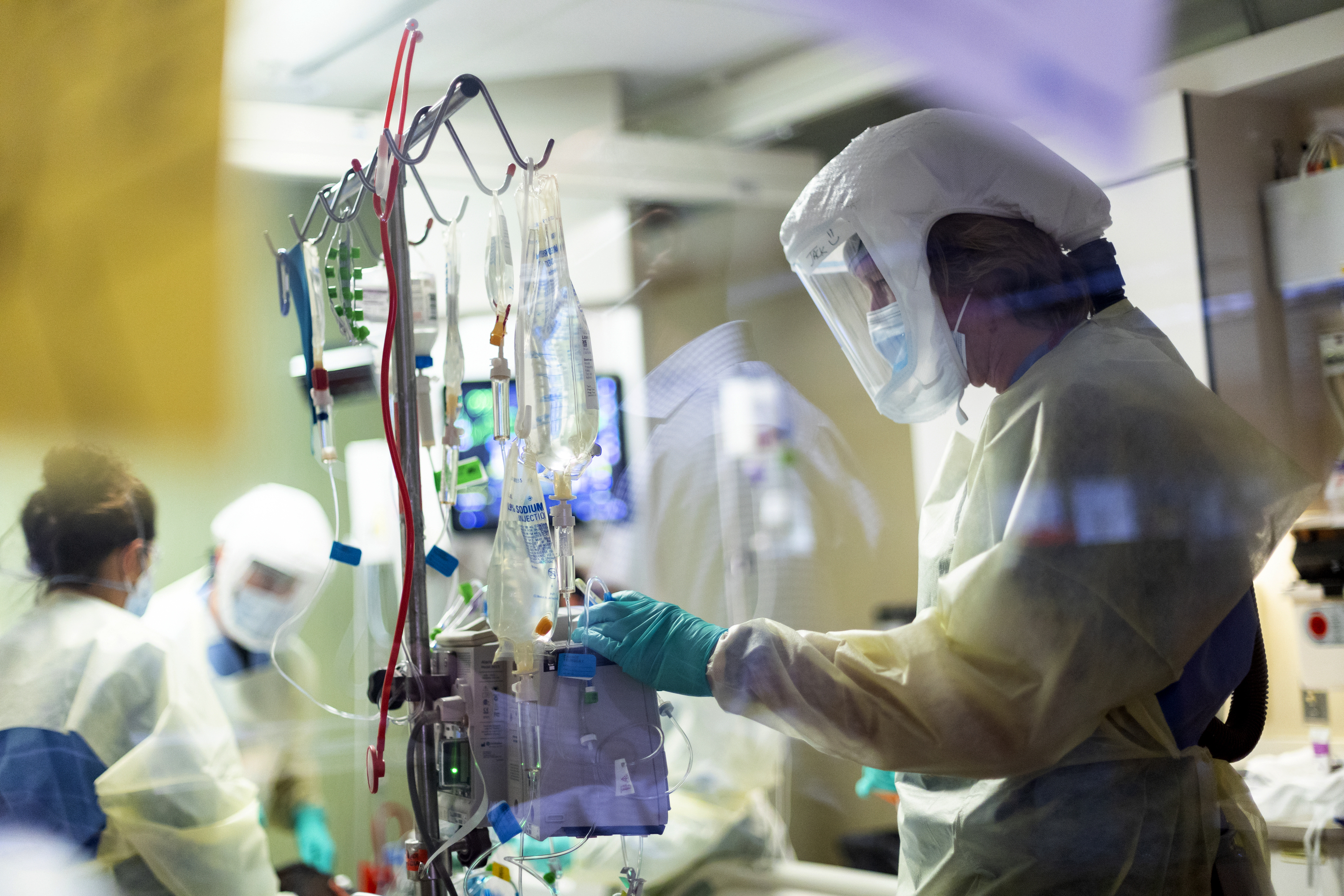 Jack Kingsley attends to a COVID-19 patient in the Medical Intensive care unit at St. Luke's Boise Medical Center in Boise on Aug. 31.