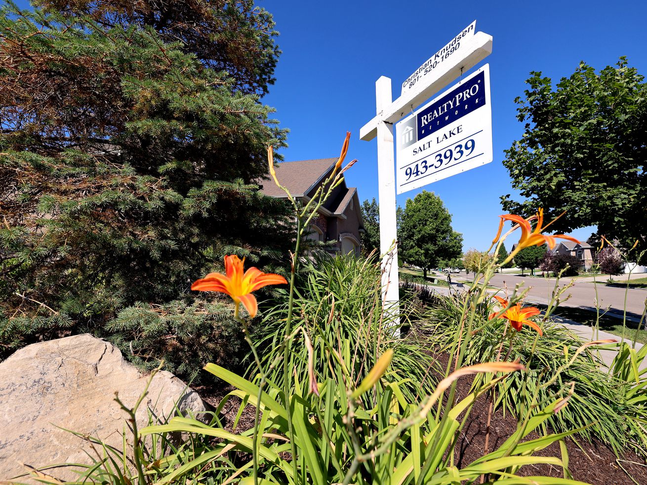 A home for sale sign is pictured in the Salt Lake
Valley on July 16. It appears Utah’s housing market
may be cooling off ever so slightly, according to the latest home
sale figures.