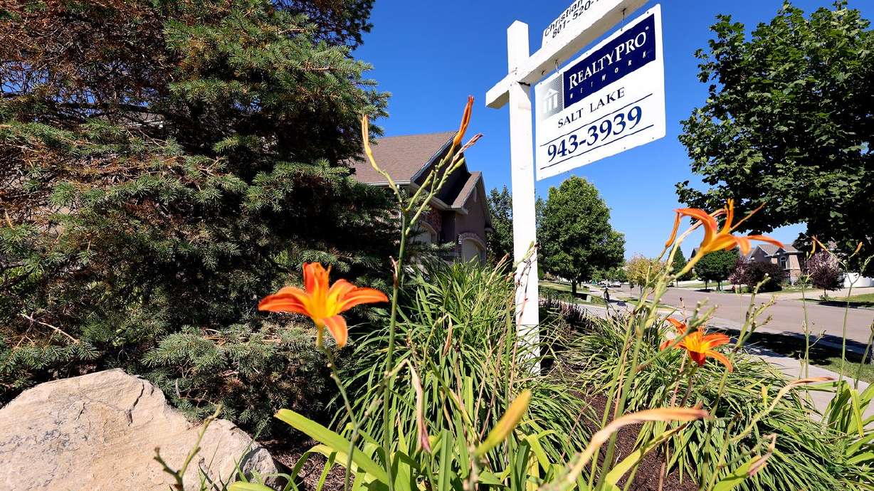 A home for sale sign is pictured in the Salt Lake
Valley on July 16. It appears Utah’s housing market
may be cooling off ever so slightly, according to the latest home
sale figures.