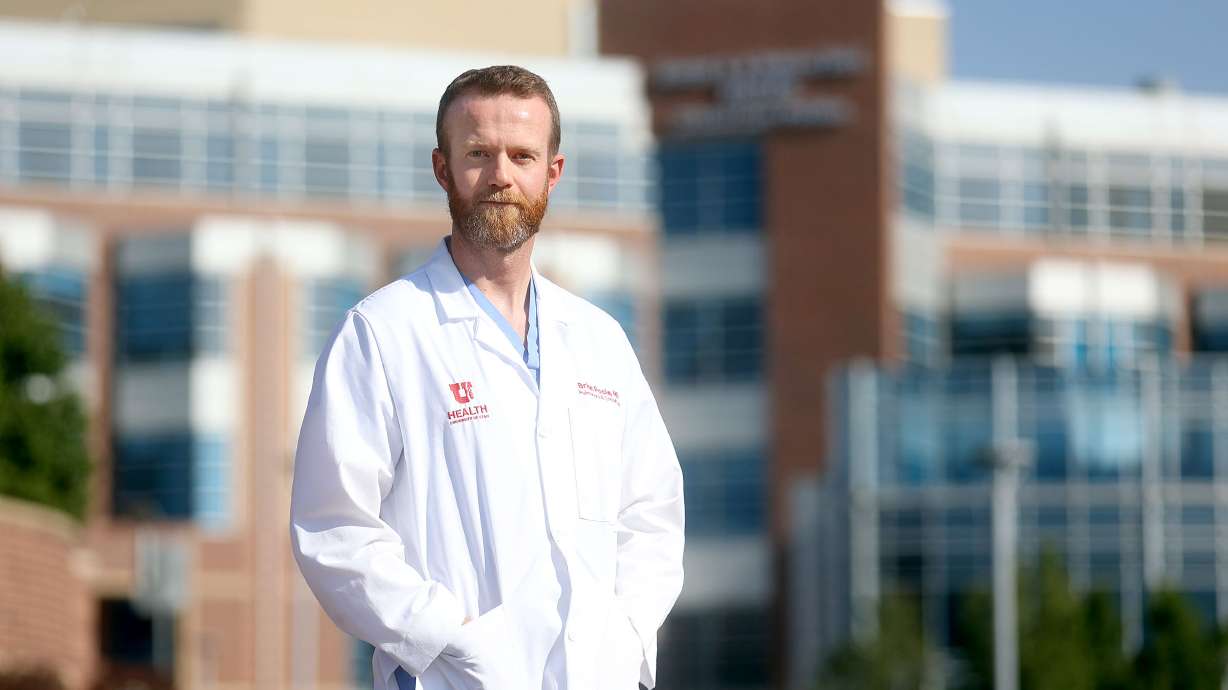 Dr. Brian Poole, a pulmonary and critical care medicine fellow, poses for a portrait near the University of Utah Hospital in Salt Lake City on Tuesday.