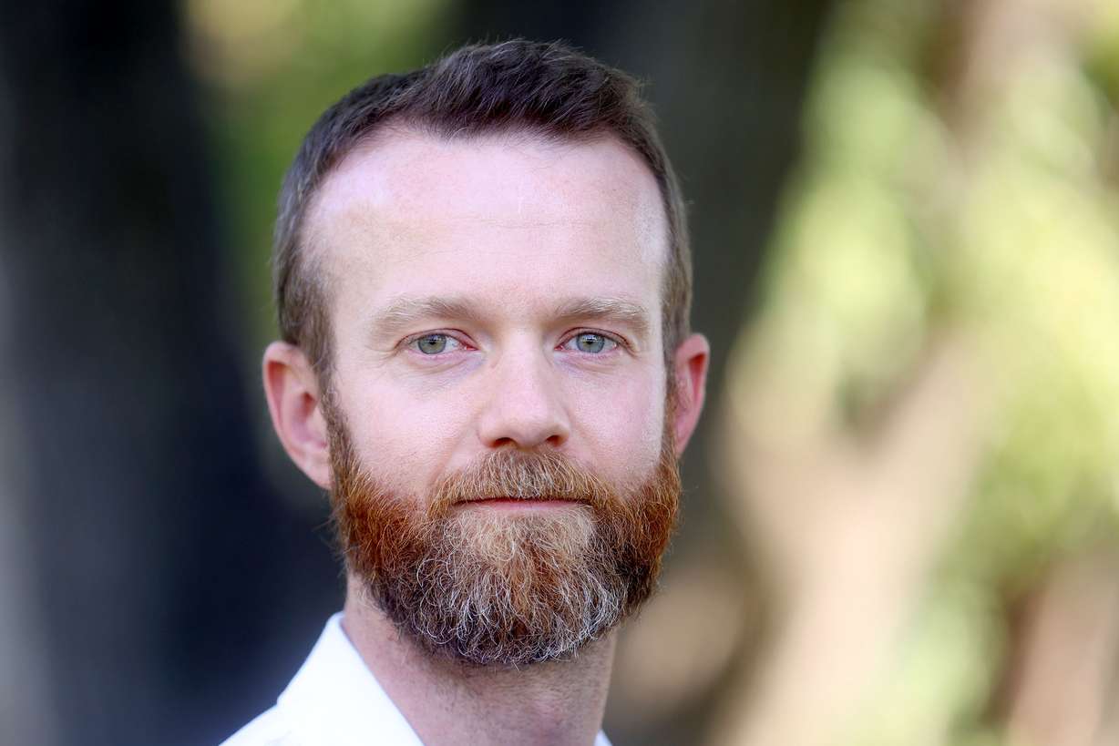 Dr. Brian Poole, a pulmonary and critical care medicine fellow, poses for a portrait at Reservoir Park in Salt Lake City on Tuesday..