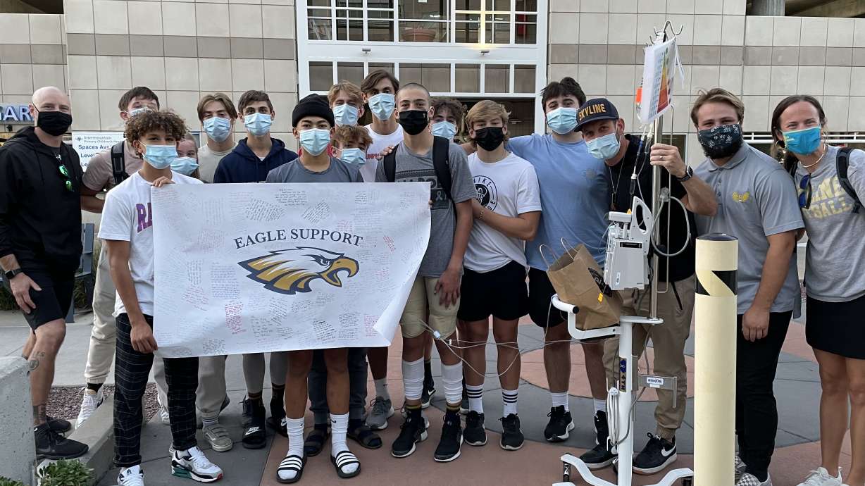 Members of the Skyline football team show support to Afu Fiefia at Intermountain Primary Children's Hospital Thursday night