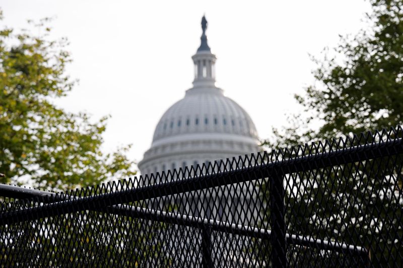 A security fence, erected in a single overnight effort, surrounds the U.S. Capitol Thursday ahead of an expected rally Saturday in support of the Jan. 6 defendants in Washington, D.C.