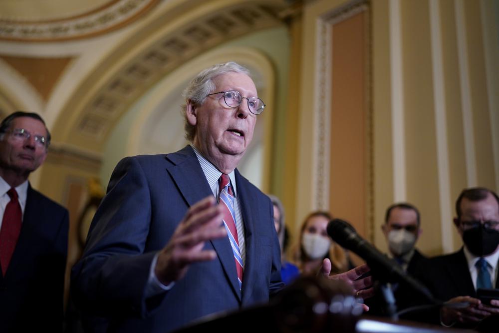 In this Tuesday photo, Senate Minority Leader Mitch McConnell, R-Ky., speaks to reporters at the Capitol in Washington. McConnell has warned Treasury Secretary Janet Yellen he is not budging on his demand that Democrats go it alone on the federal debt limit, deepening the emerging standoff in Congress over how to boost the government's borrowing authority.