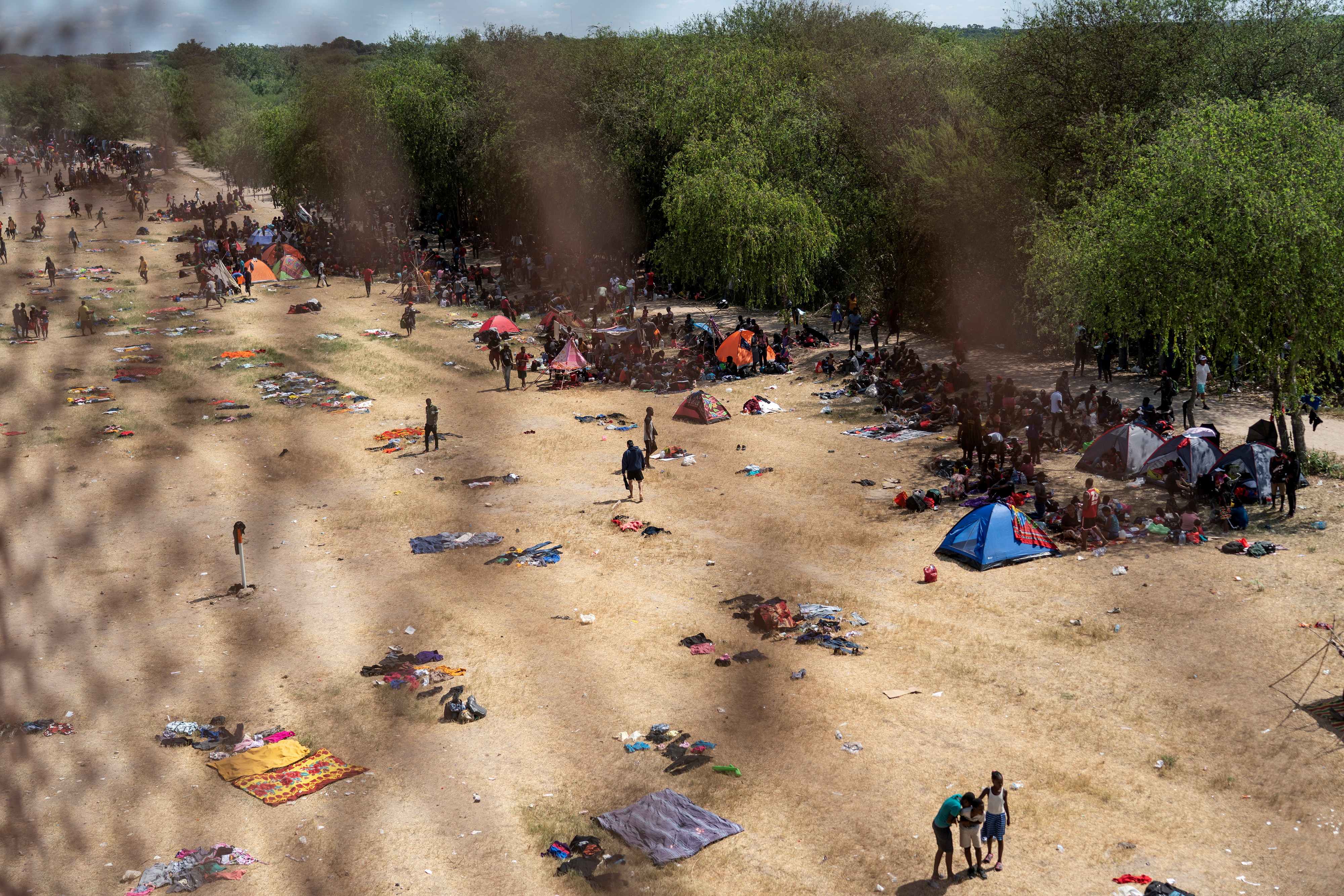 Migrants seeking asylum in the U.S. rest near the International Bridge between Mexico and the U.S. as they wait to be processed, in Del Rio, Texas, U.S., on Sept.16.