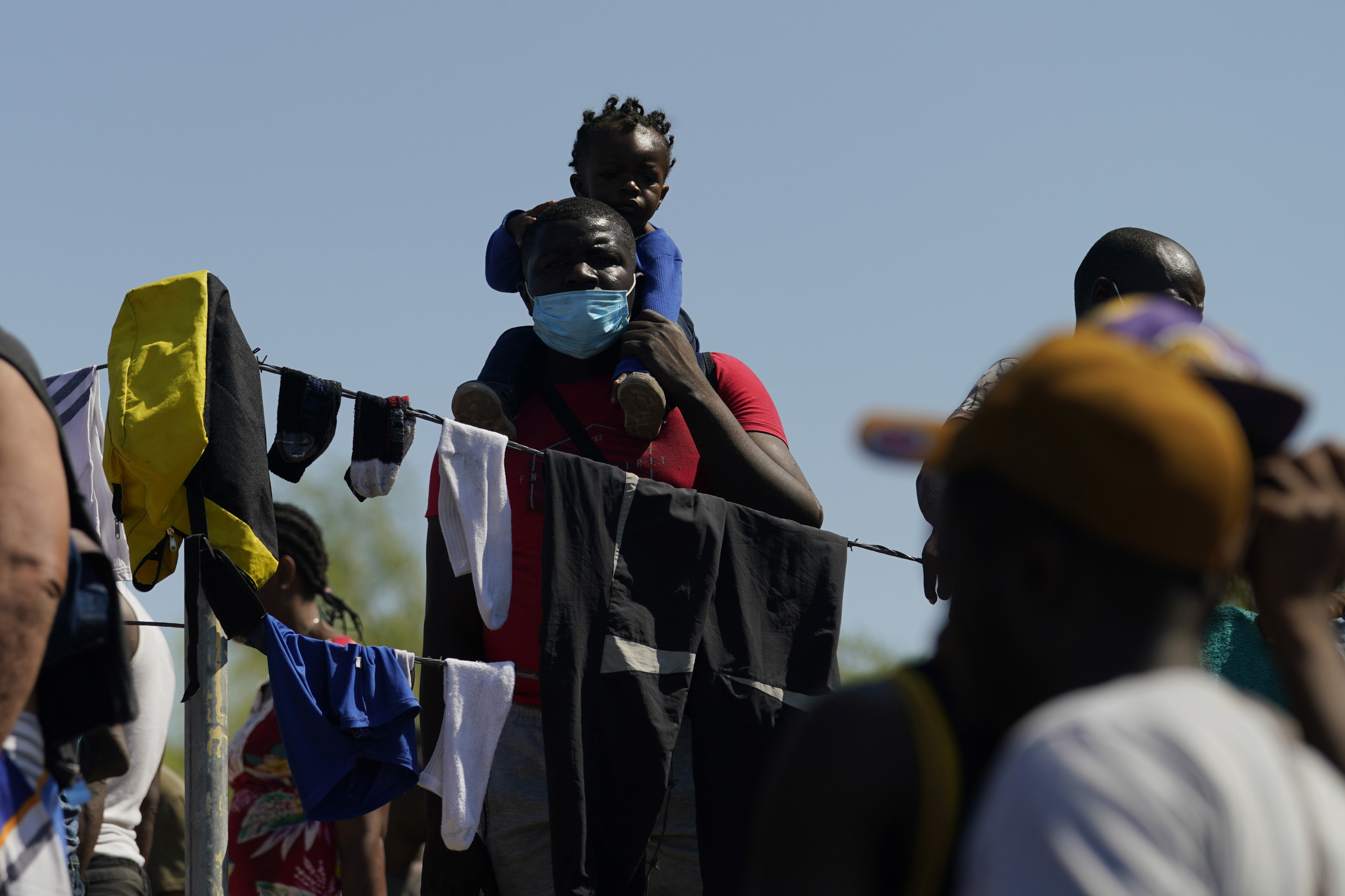 Migrants in a make-shift camp after crossing the Rio Grande to the United States from Mexico, Friday, in Del Rio, Texas.