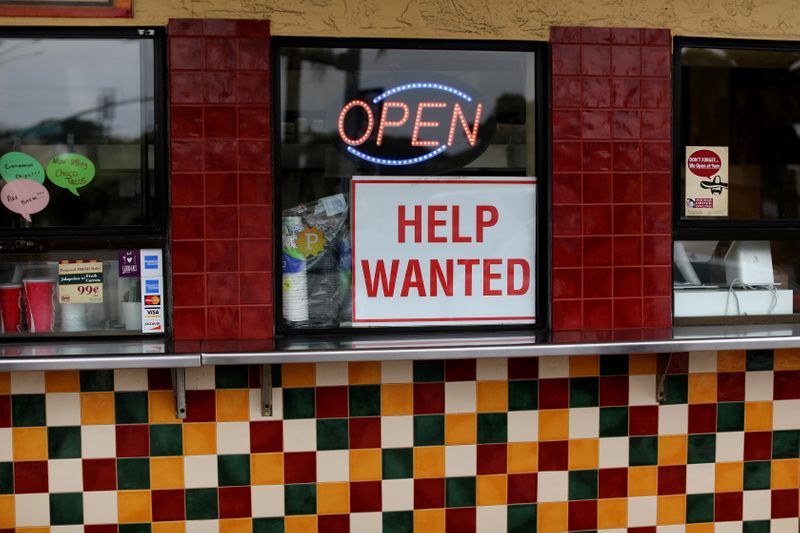 A help wanted sign is posted at a taco stand in Solana Beach, California, on  July 17, 2017.