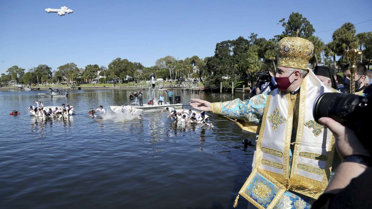 His Eminence Archbishop Elpidophoros, Primate of the Greek Orthodox Archdiocese of America throws a cross into Spring Bayou during the 115th year of the annual Epiphany celebration in Tarpon Springs, Fla., on Jan. 6. Leaders of the archdiocese said Thursday, that while some people may have medical conditions for not receiving the vaccine, “there is no exemption in the Orthodox Church for Her faithful from any vaccination for religious reasons.”