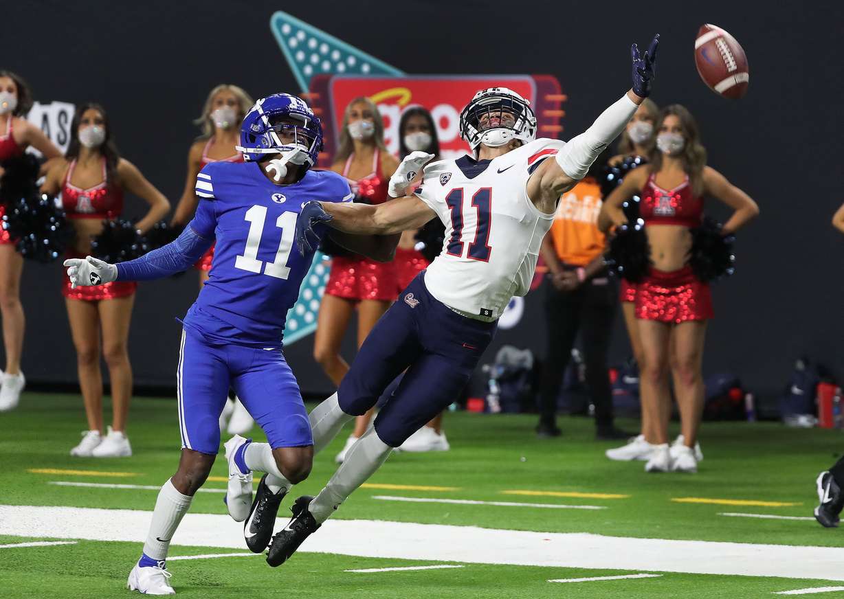 Brigham Young Cougars defensive back Isaiah Herron (11) is called for interference on Arizona Wildcats wide receiver Tayvian Cunningham (11) during the Vegas Kickoff Classic in Las Vegas on Saturday, Sept. 4, 2021. BYU won 24-16.