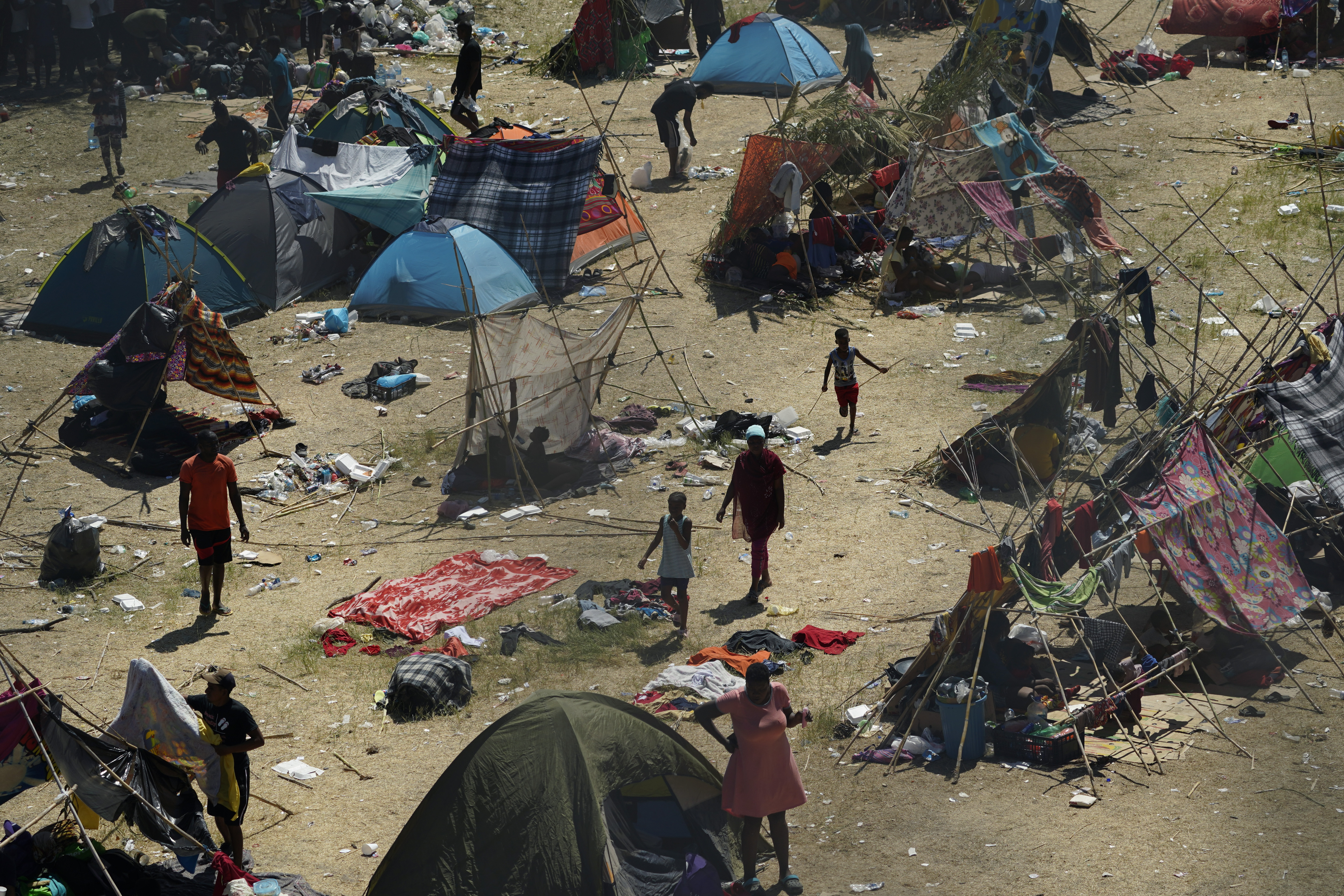 Haitian migrants set up make-shift camp along the Rio Grande after crossing into the United States from Mexico, Friday, in Del Rio, Texas. Thousands of Haitian migrants have assembled under and around a bridge in Del Rio presenting the Biden administration with a fresh and immediate challenge as it tries to manage large numbers of asylum-seekers who have been reaching U.S. soil.