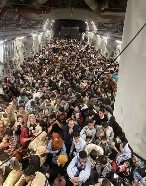 Afghan citizens pack inside a U.S. Air Force C-17
Globemaster III, as they are transported from Hamid Karzai
International Airport in Afghanistan on Aug. 15.