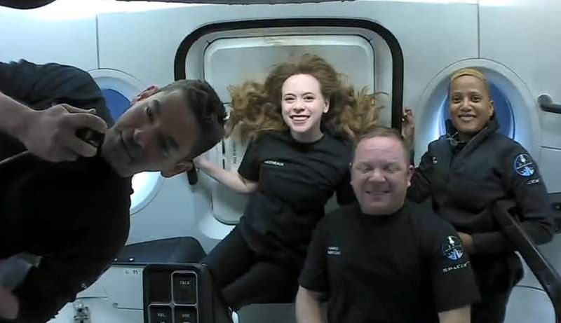 Inspiration4 crew Jared Isaacman, Sian Proctor, Hayley Arceneaux and Chris Sembroski seen on their first day in space in this handout photo released on Friday.