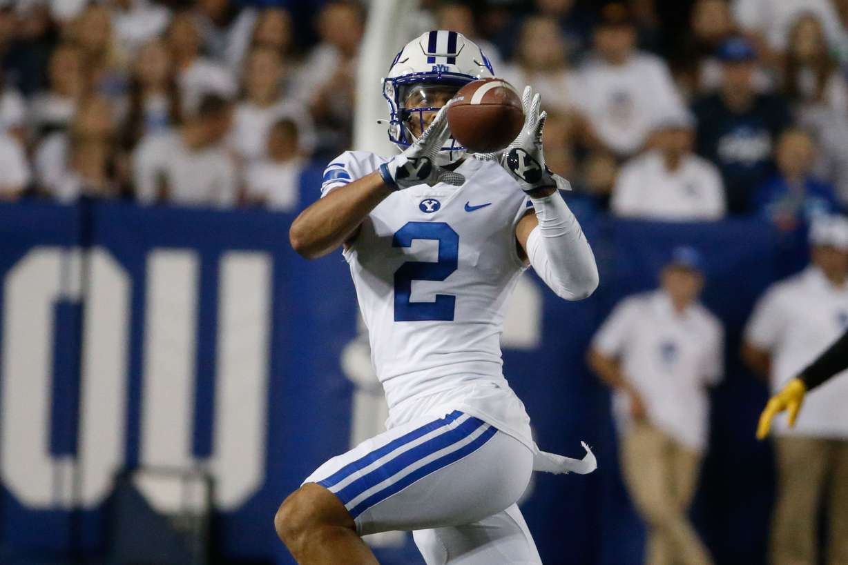 Brigham Young wide receiver Neil Pau'u (2) attempts a successful pass during an NCAA college football game against Arizona State at LaVell Edwards Stadium in Provo on Saturday, Sept. 18, 2021.