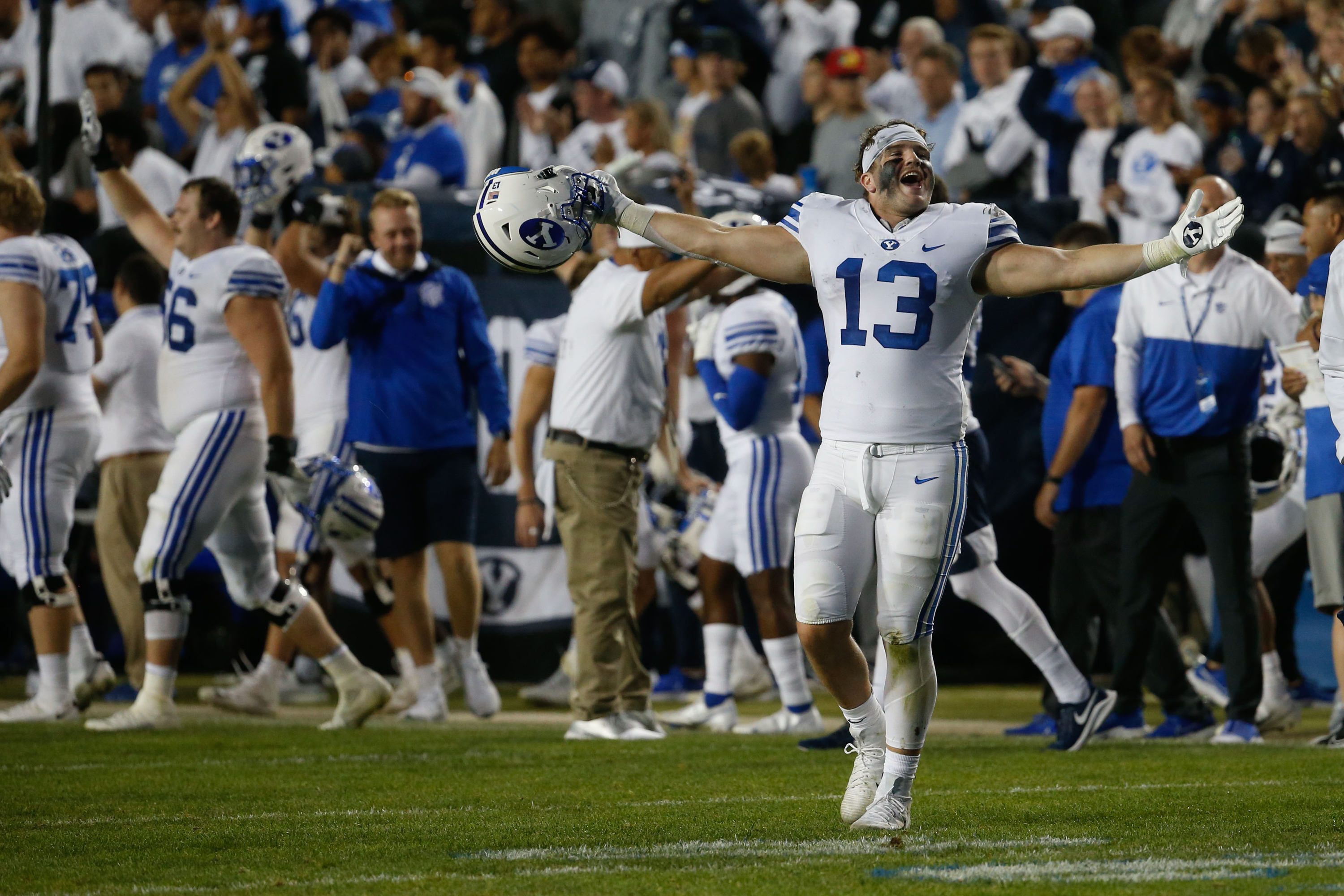 BYU players celebrate after winning against Arizona State during an NCAA college football game at LaVell Edwards Stadium in Provo on Saturday, Sept. 18, 2021.