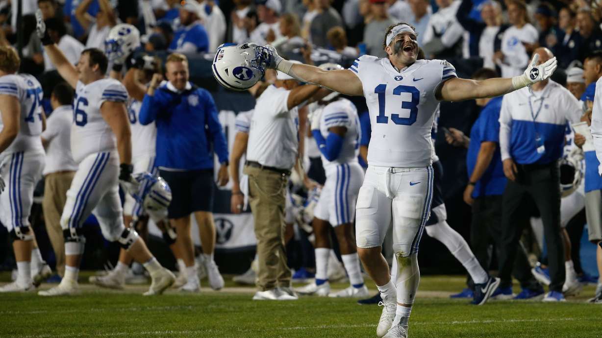 BYU players celebrate after winning against Arizona State during an NCAA college football game at LaVell Edwards Stadium in Provo on Saturday, Sept. 18, 2021.