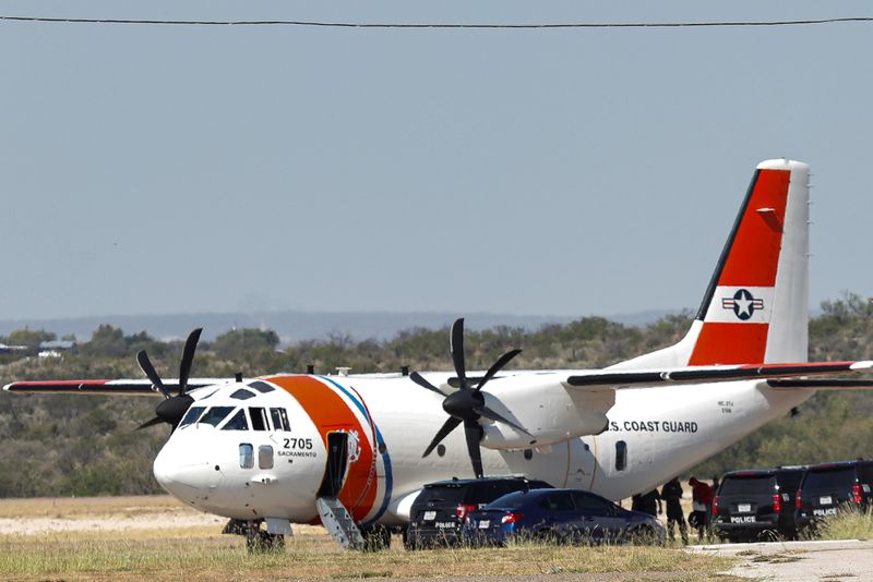 People board an U.S. Coast Guard airplane at the Del Rio International Airport as U.S. authorities accelerate removal of migrants at border with Mexico, in Del Rio, Texas, on Sunday.