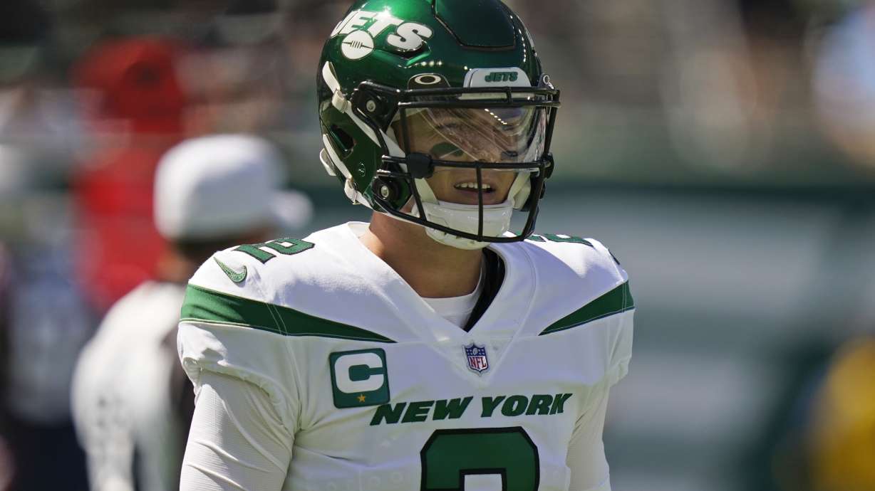 New York Jets quarterback Zach Wilson reacts after throwing an interception during the first half of an NFL football game against the New England Patriots, Sunday, Sept. 19, 2021, in East Rutherford, N.J.