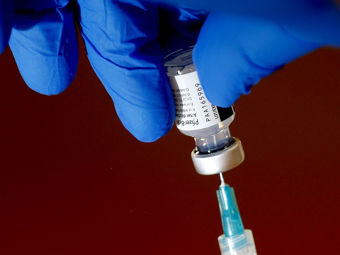 The Pfizer-BioNTech COVID-19 vaccine is drawn into a syringe at the South Davis Senior Activity Center in Bountiful on
Aug. 25. On Monday, Utah health officials confirmed 3,393 new COVID-19 cases since Friday, as well as 17 new deaths.